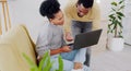 Laptop, search and couple in a home living room browsing, online shopping and talking together on internet. Share Royalty Free Stock Photo