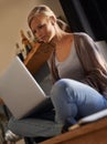 Laptop, search and woman relax in a house with social media, streaming or watching movies. Pc, subscription and female