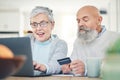 Laptop, senior couple and credit card in home for online shopping, digital banking or payment. Computer, ecommerce and Royalty Free Stock Photo