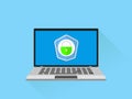 Laptop with shield and lock on table. Computer security concept. Vector Illustration