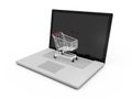 Laptop and Shopping Cart Royalty Free Stock Photo