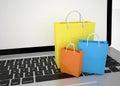 Laptop and shopping pags Royalty Free Stock Photo