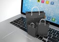 Laptop and shopping pags Royalty Free Stock Photo