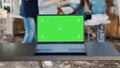 Laptop showing isolated green screen