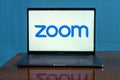 Laptop showing Zoom Cloud Meetings app logo. Royalty Free Stock Photo