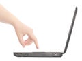 The laptop a side view a female hand touch on keys Royalty Free Stock Photo