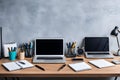 A laptop sits on a desk with a cup of coffee and a keyboard Royalty Free Stock Photo