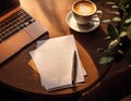 A laptop sits open on a cafe table next to a coffee Royalty Free Stock Photo