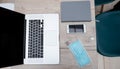 Laptop, smartphone and protective mask on the office Desk Royalty Free Stock Photo