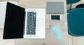 laptop, smartphone and protective mask on the office Desk Royalty Free Stock Photo