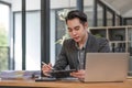 Laptop and smiling asia man, Young happy asian businessman working with laptop computer at office background, , business Royalty Free Stock Photo