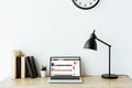 laptop with soundcloud website on screen on work desk