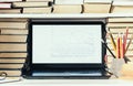 Laptop, stack of books, notebook, pencils in office background for education learning concept Royalty Free Stock Photo