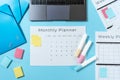 Laptop, stationery and planner on blue pastel background Royalty Free Stock Photo
