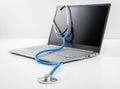 laptop and stethoscope on white background. online medicine  doctor online consultation. Healthy Hardware. Telemedicine concept. Royalty Free Stock Photo