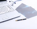 Laptop ,stethoscope and x-ray on the table Royalty Free Stock Photo