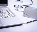 Laptop ,stethoscope and x-ray on the table Royalty Free Stock Photo