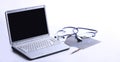 Laptop ,stethoscope and x-ray on the table Royalty Free Stock Photo