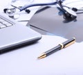 Laptop ,stethoscope and x-ray on the table Royalty Free Stock Photo
