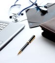 Laptop ,stethoscope and x-ray on the table Royalty Free Stock Photo