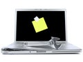 Laptop with sticky note and tool Royalty Free Stock Photo