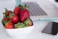 Laptop and strawberries