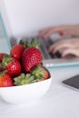 Laptop and strawberries