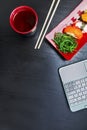 Laptop with sushi sashimi set with copy space Royalty Free Stock Photo