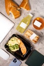 Top view of delicious lunch with laptop on table Royalty Free Stock Photo