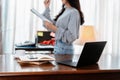 Laptop on the table and student hold documant background. Student learning at home