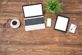 Laptop and tablet computer on wooden background Royalty Free Stock Photo