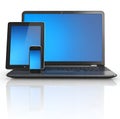 Modern digital devices: laptop, tablet, smartphone with blue screens Royalty Free Stock Photo
