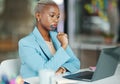 Laptop, thinking and a business black woman at work in her office on a review, proposal or project. Serious, focus and Royalty Free Stock Photo
