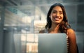 Laptop, thinking and glass with a business woman in the office, working while sitting at her desk. Computer, idea or Royalty Free Stock Photo