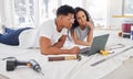 Laptop, thinking and renovation a couple in their new home together for a remodeling project. Construction, real estate Royalty Free Stock Photo