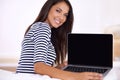 This is the laptop to suit your lifestyle. Portrait of an attractive young woman holding open her laptop.