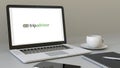 Laptop with TripAdvisor logo on the screen. Modern workplace conceptual editorial 3D rendering Royalty Free Stock Photo