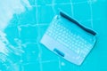 Laptop under water. Minicomputer at the bottom of the pool. The concept of obstruction at work. Blur abstract background Royalty Free Stock Photo