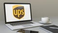 Laptop with United Parcel Service UPS logo on the screen. Modern workplace conceptual editorial 3D rendering