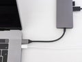 Laptop with usb-c hub on white desk Royalty Free Stock Photo