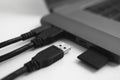 Laptop with USB Type-C adapter with pluged USB cables and SD card. The USB adapter under the Type-C connector for laptop Royalty Free Stock Photo