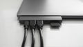 Laptop with USB Type-C adapter with pluged USB cables and SD card. The USB adapter under the Type-C connector for laptop Royalty Free Stock Photo