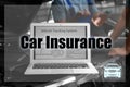 Laptop with vehicle tracking system and mechanics on background. Car insurance