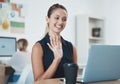 Laptop, video call and business woman in the office with smile and waving hand. Businesswoman using computer webcam for