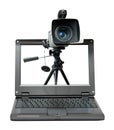 Laptop with video camera on tripod