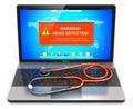 Laptop with virus attack warning message on screen and stethoscope Royalty Free Stock Photo