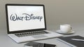 Laptop with Walt Disney Pictures logo on the screen. Modern workplace conceptual editorial 3D rendering