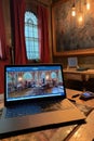 laptop with webinar presentation on screen
