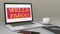 Laptop with Wells Fargo logo on the screen. Modern workplace conceptual editorial 3D rendering