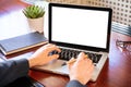 Laptop with white blank screen on a wooden desk Royalty Free Stock Photo